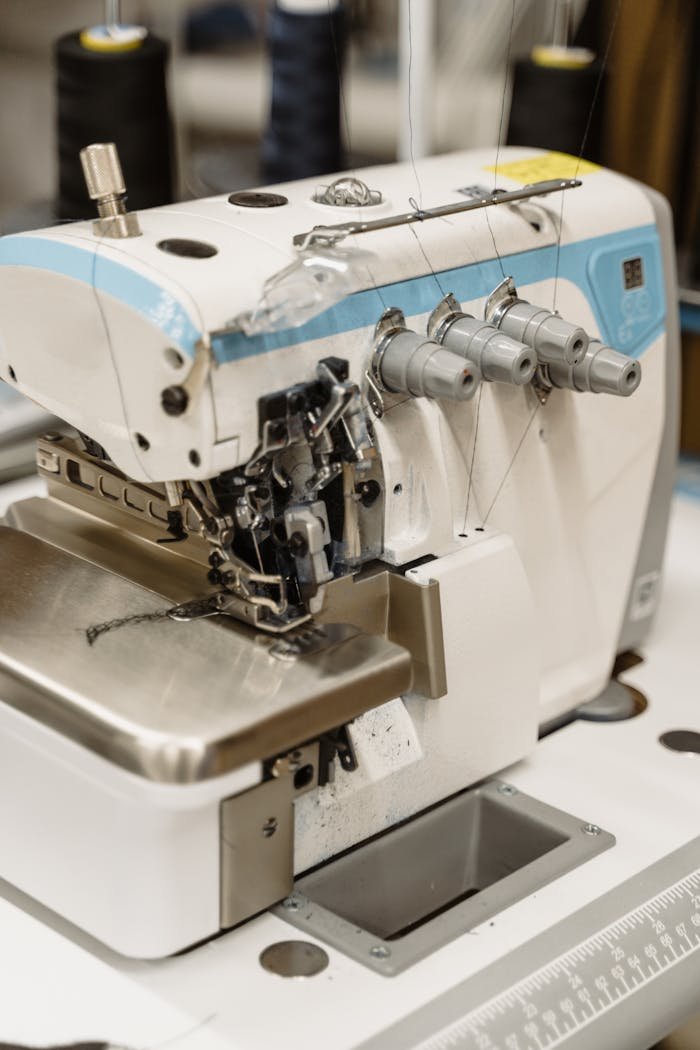 Detailed view of industrial sewing machine equipment in action, highlighting precision.